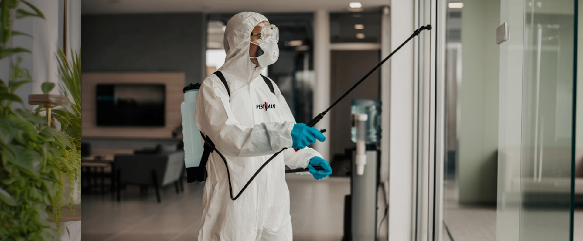 PestMan technician carrying out a fogging treatment in a Dubai residential lobby